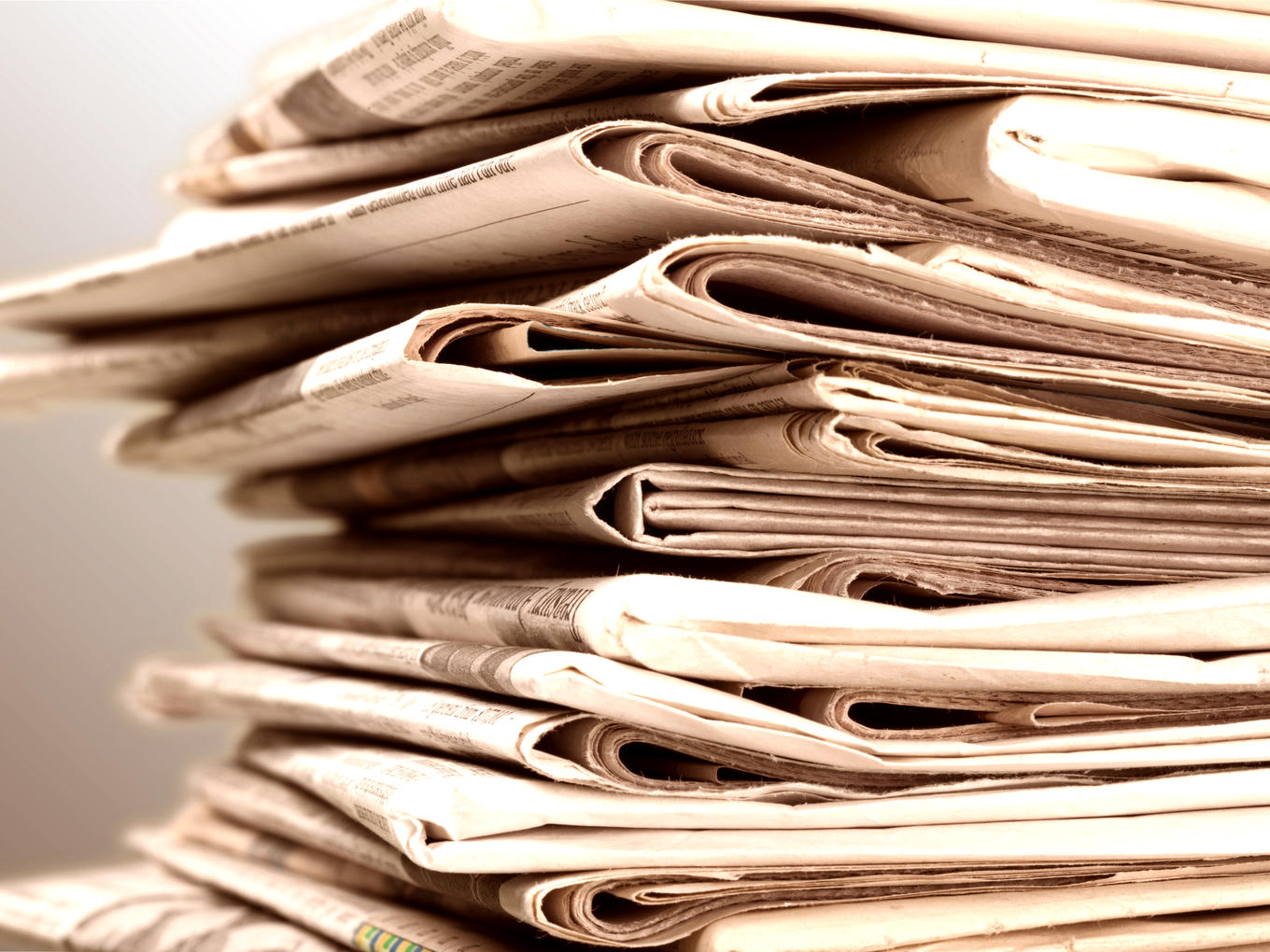 pile-newspapers-cropped-sepia